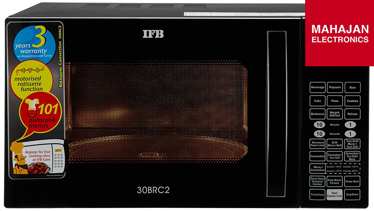 IFB microwave oven with warranty label and Mahajan Electronics branding