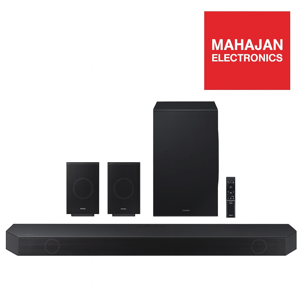 Black home theater system with speakers and a soundbar on a white background, featuring the Mahajan Electronics logo.