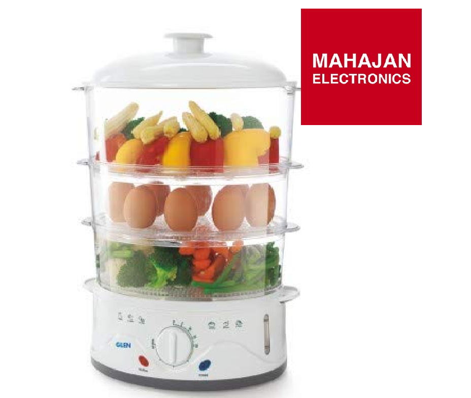Multi-layered food steamer with vegetables and eggs, branded as Mahajan Electronics.